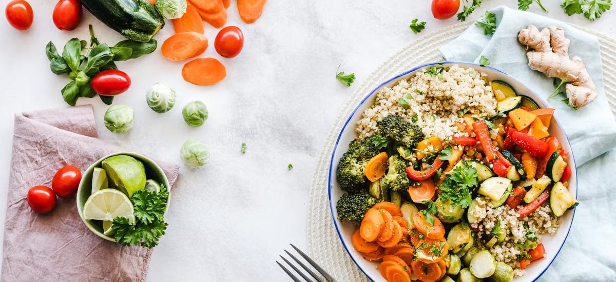 Colorful quinoa salad with fresh vegetables creates a healthy, balanced meal.